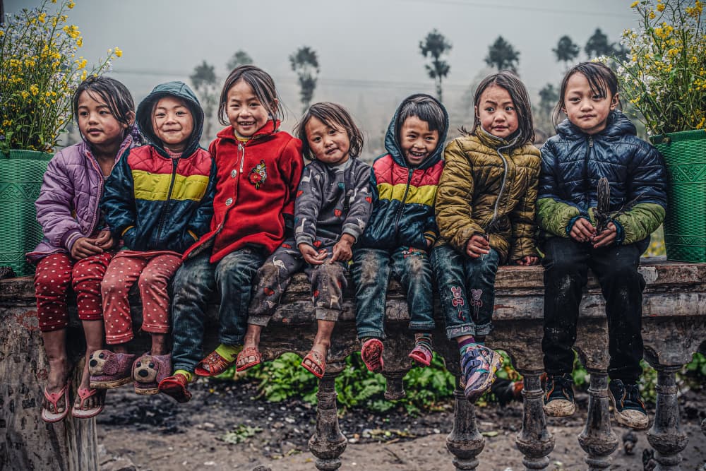 Smiling Village Children by Marco Tagliarino — canvas wall art