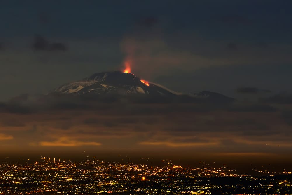 Volcano Over City Lights by Massimo Tamajo — canvas wall art