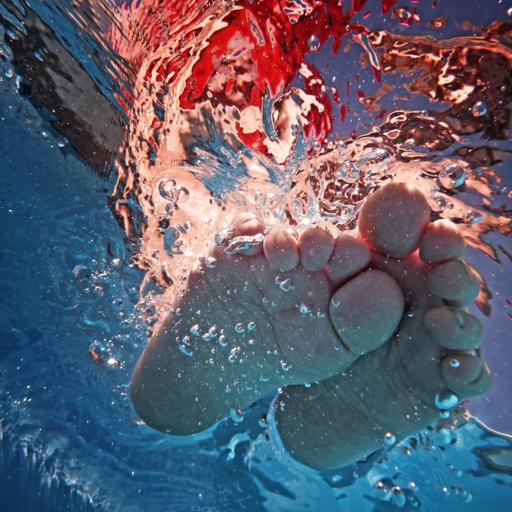 Refreshing Underwater Feet by Christine Frick — canvas wall art
