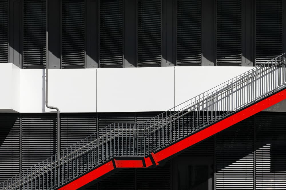 Red Stairway Shadows by Hans-Wolfgang Hawerkamp — canvas wall art