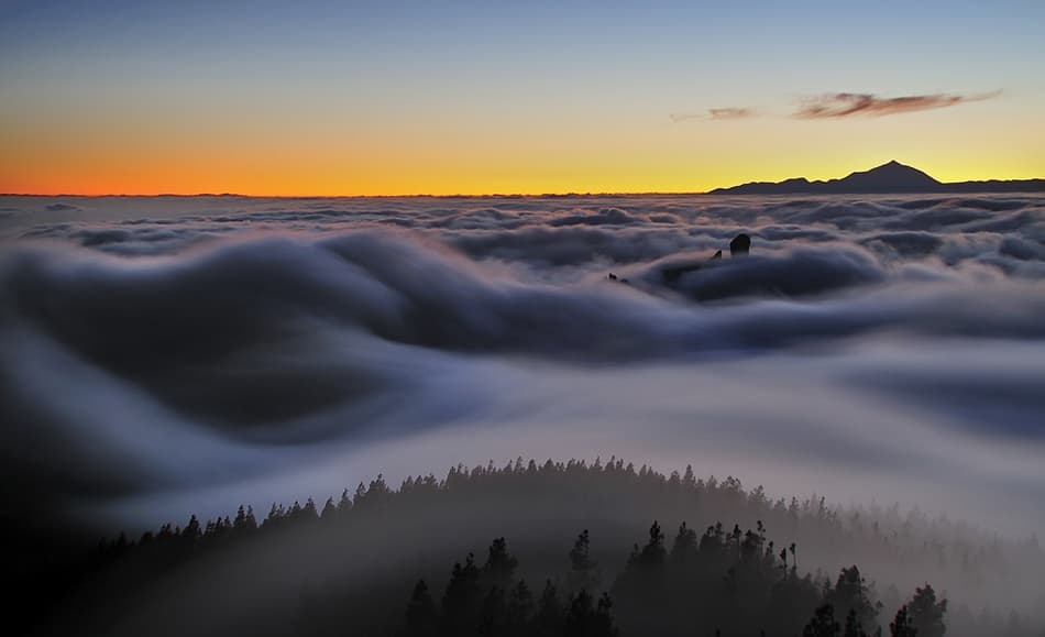 Above The Clouds Sunset by Daniel Montero — canvas wall art