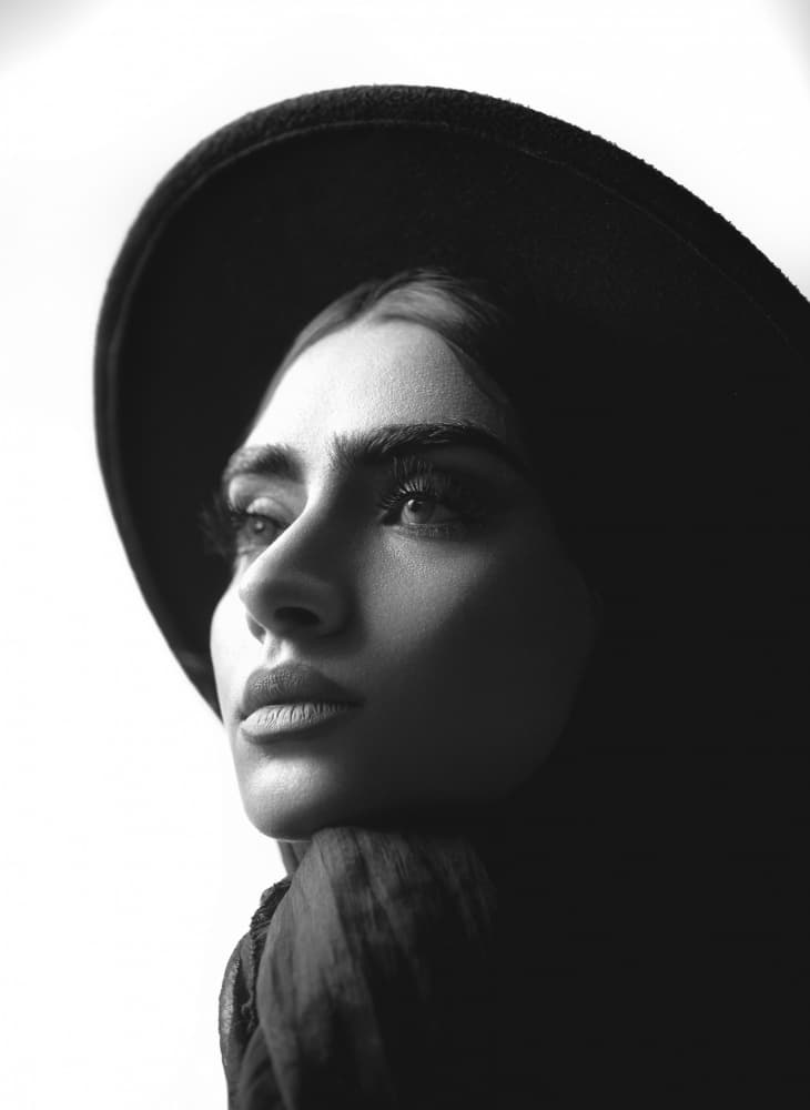 Pensive Woman In Hat by Morteza ghanbari — canvas wall art