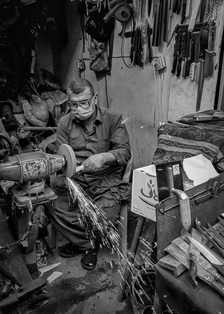 Craftsman Sharpening Blade by Bashar Alsofey — canvas wall art