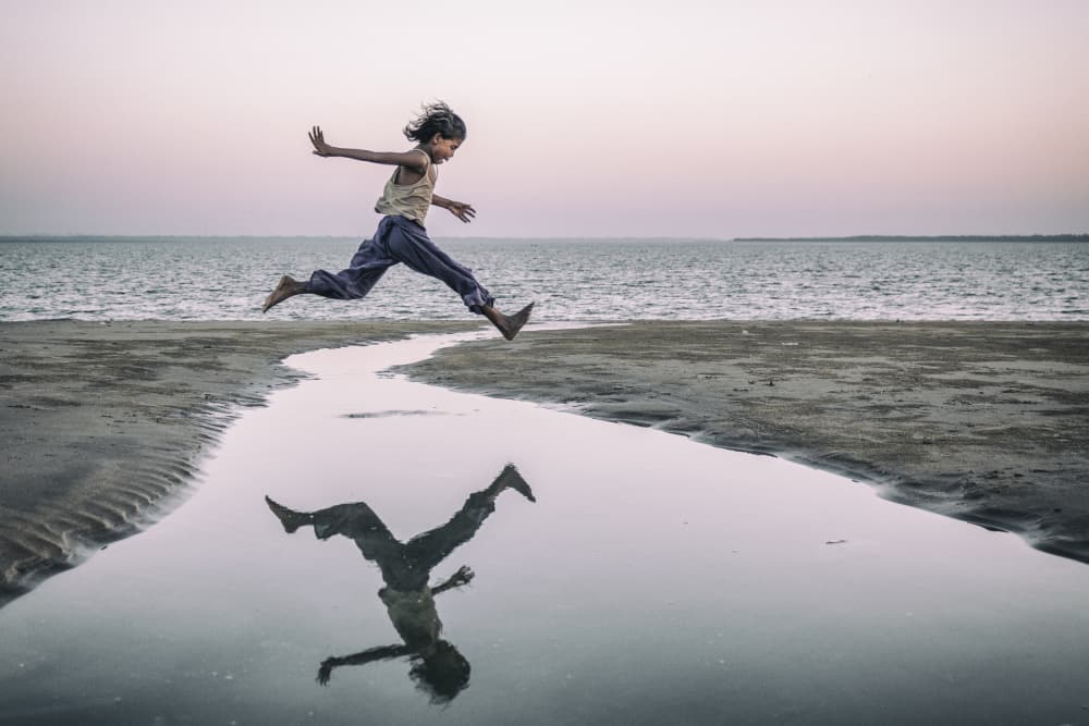 Beach Jump Reflection by Marcel Rebro — canvas wall art