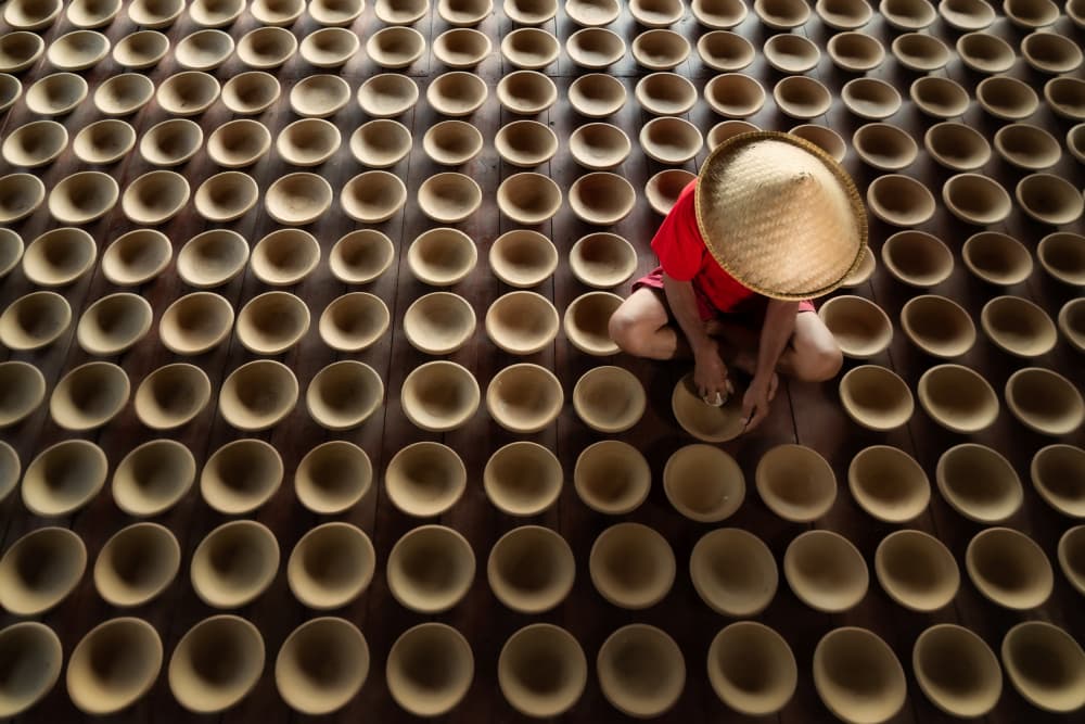Artisan Crafting Clay Bowls by Rini Widyantini — canvas wall art