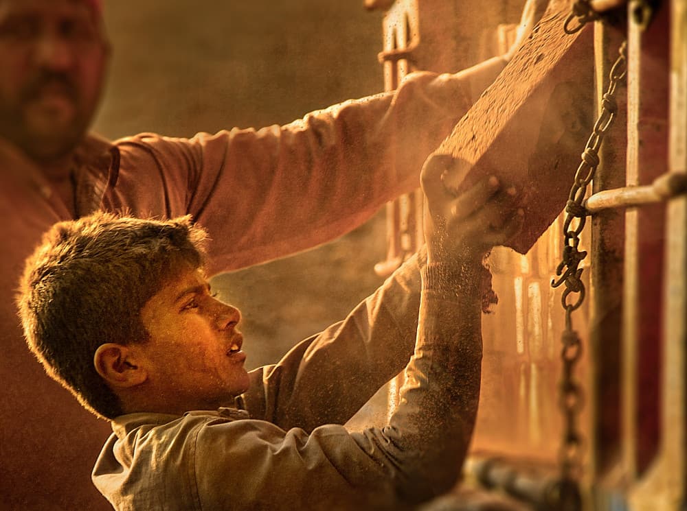 Golden Hour Brick Worker by Sayyed Nayyer Reza — canvas wall art