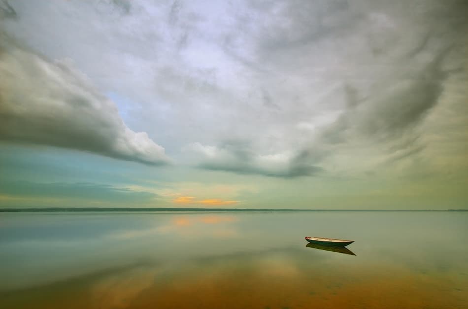 Quiet Boat on Calm Water by Krzysztof Browko — canvas wall art