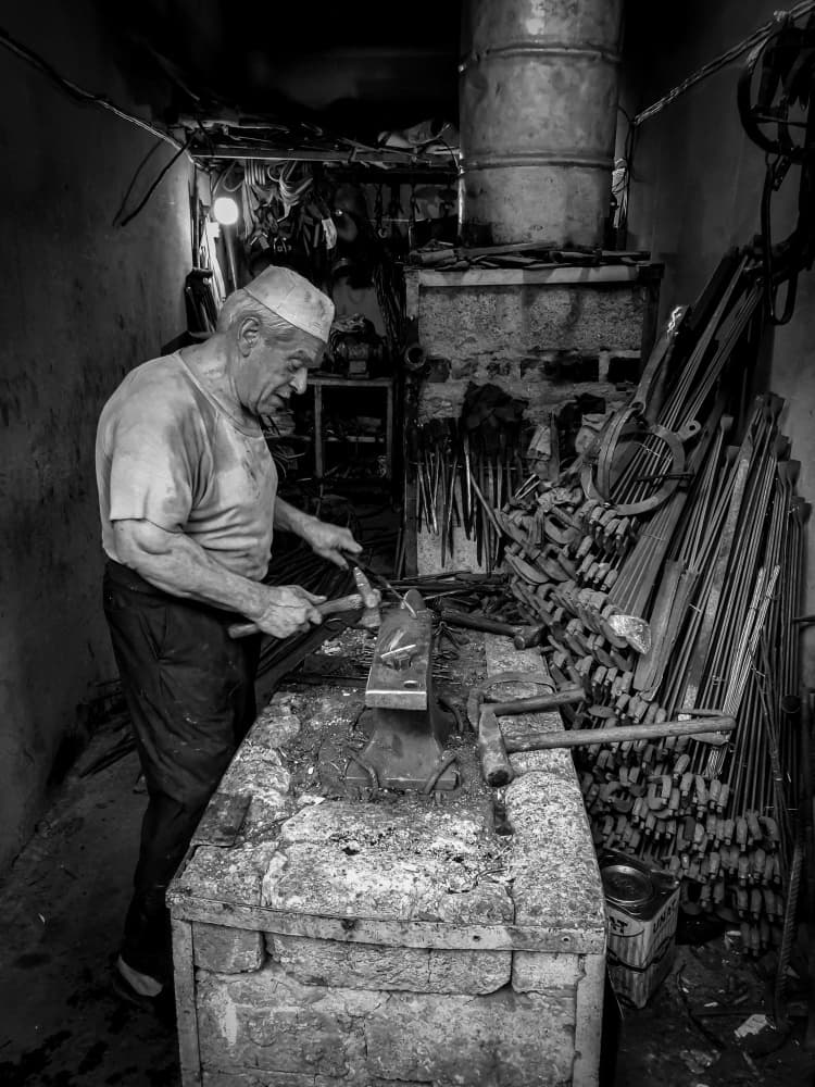Old Blacksmith At Work by Bashar Alsofey — canvas wall art