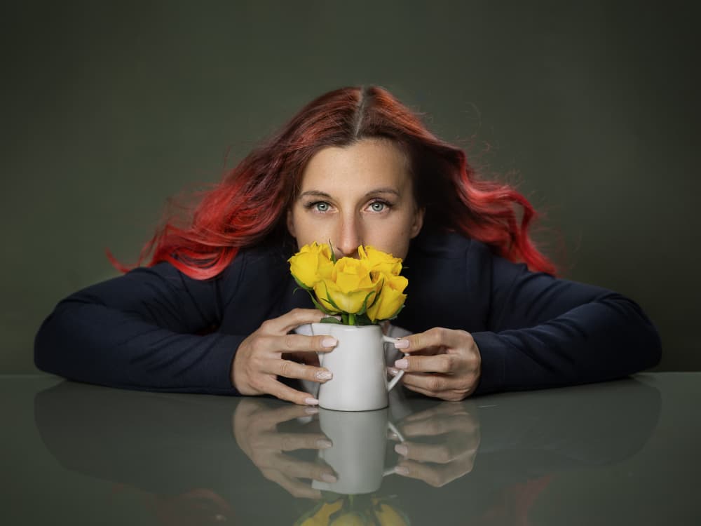 Woman Smelling Yellow Roses by Michael Allmaier — canvas wall art
