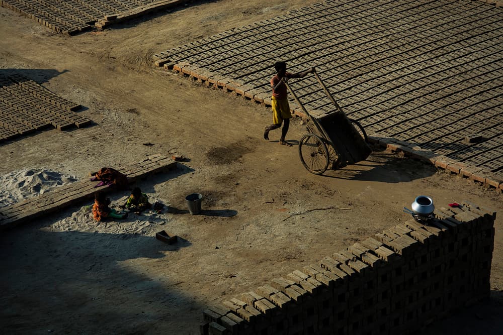 Sunlit Brick Making by shirshendu — canvas wall art