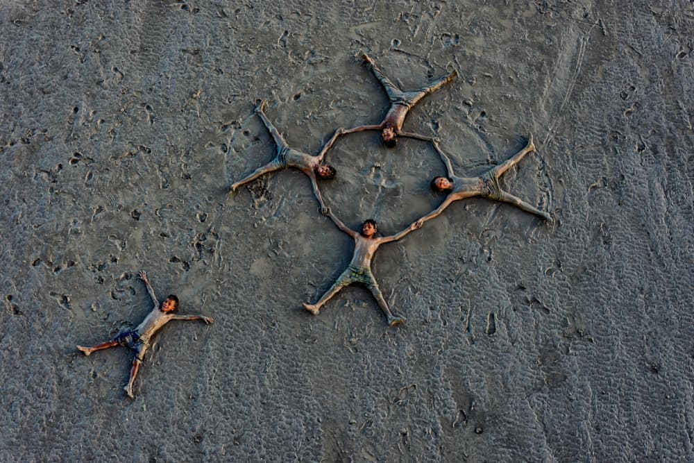 Kids Circle on Sand by Abhraneel Chakraborty — canvas wall art