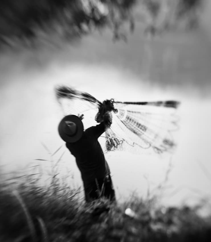 Man Casting Fishing Net by Sebastian Kisworo — canvas wall art