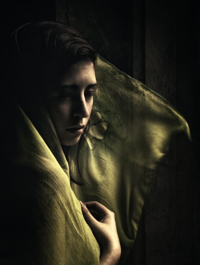 Pensive Woman In Green by Hari Sulistiawan — canvas wall art