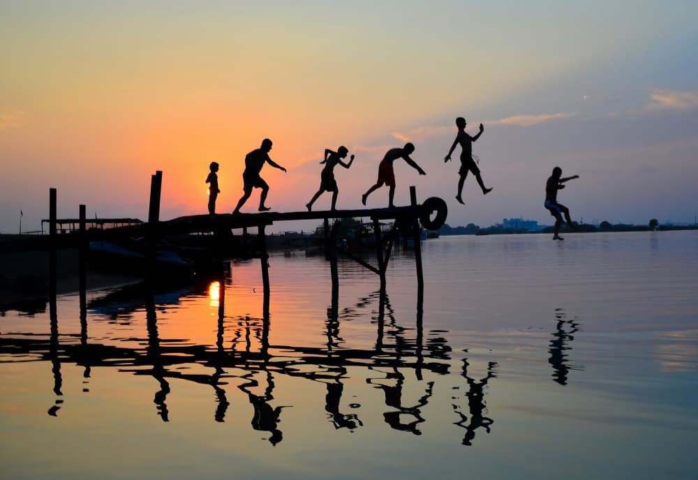 Joyful Sunset Leaps by Ali Can — canvas wall art