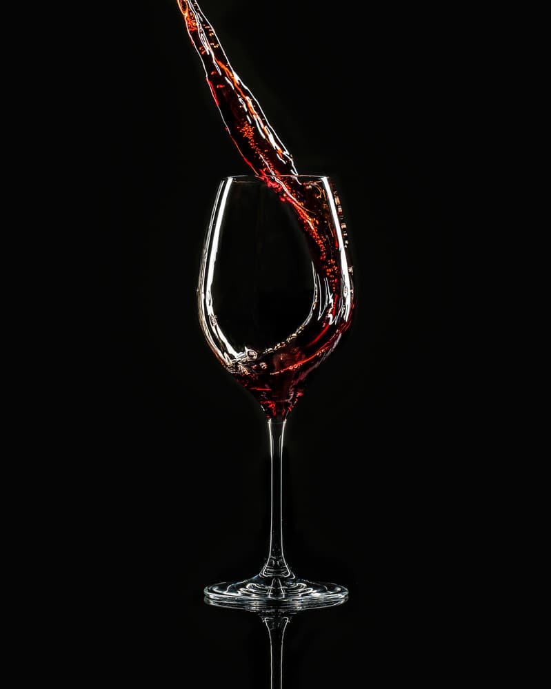 Dynamic Red Wine Pour by Jackson Carvalho — canvas wall art