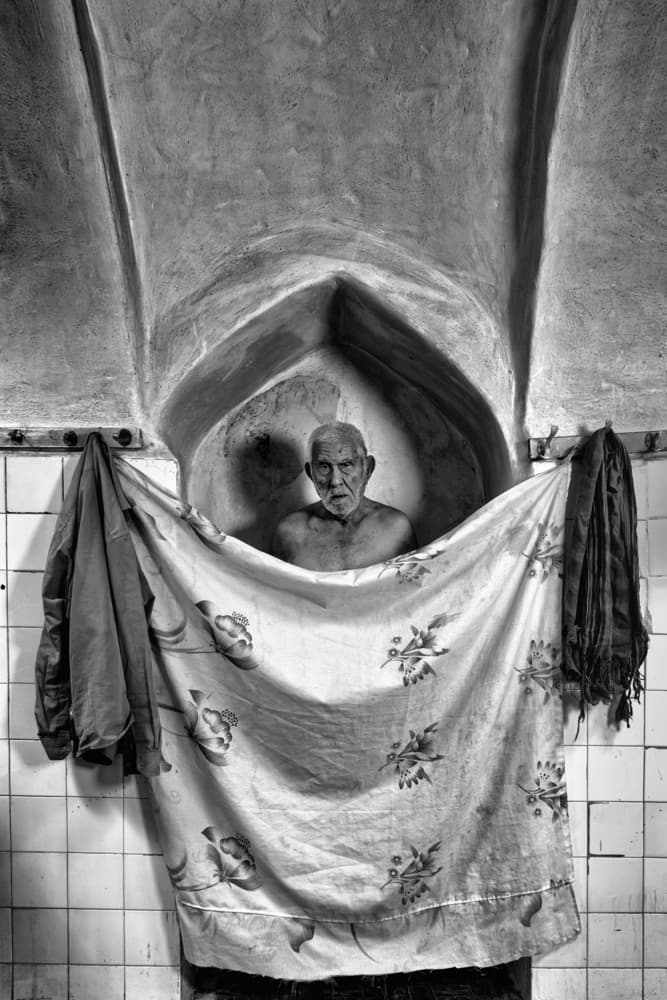 Man in Stone Alcove by Mohammadreza Momeni — canvas wall art