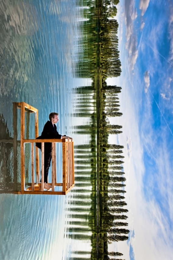 Man And Mirrored Sky by Christophe Kiciak — canvas wall art