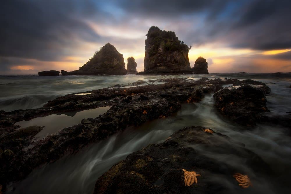 Moody Sea Stacks Sunset by Yan Zhang — canvas wall art
