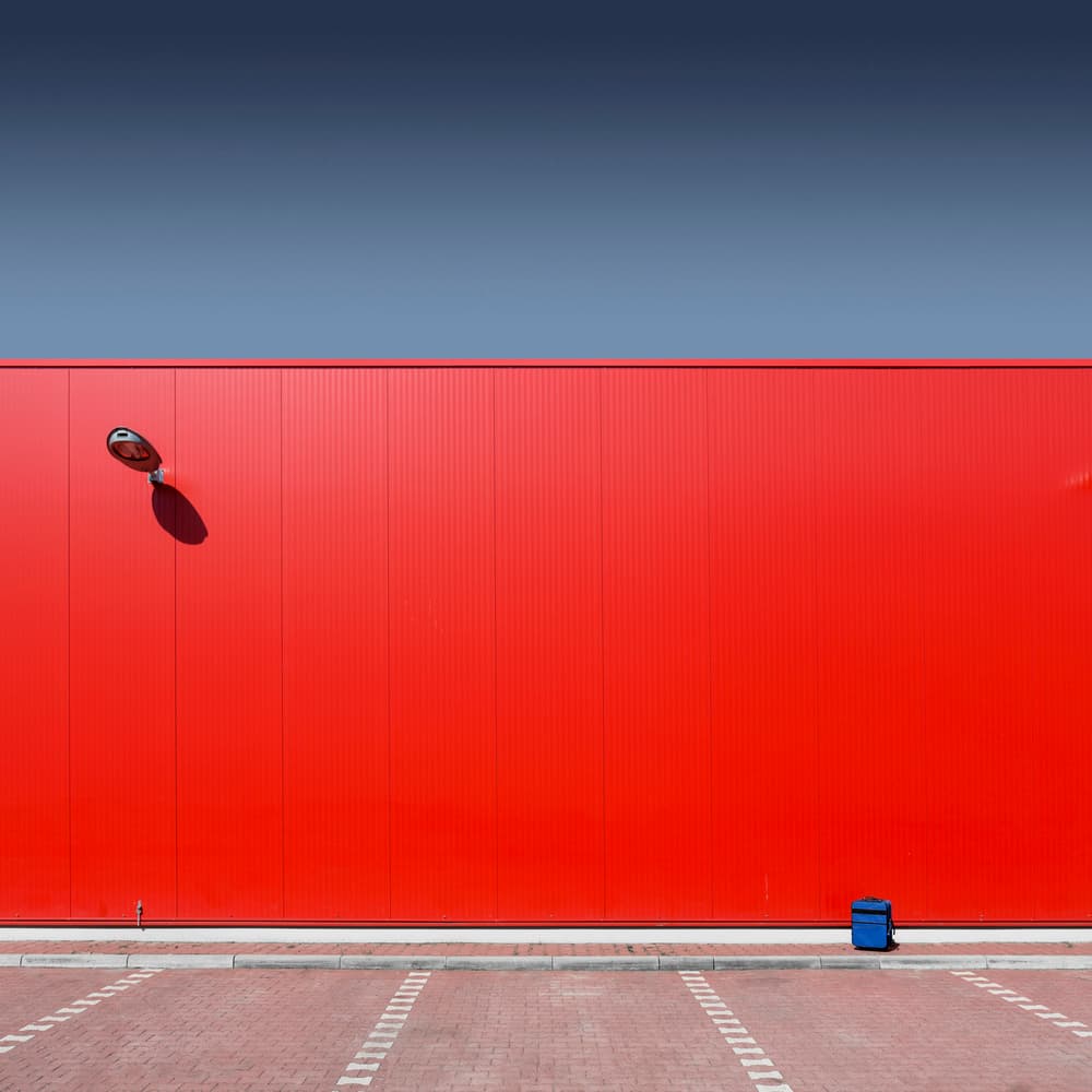 Red Wall Blue Sky by Markus Kühne — canvas wall art