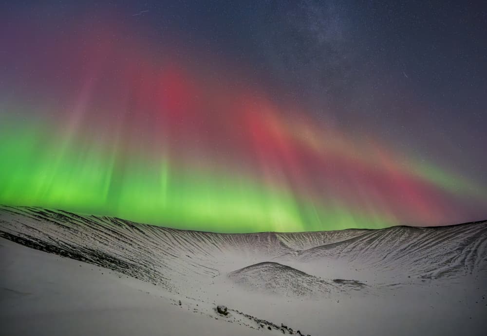 Northern Lights Over Snowy Crater by James Zhen Yu — canvas wall art