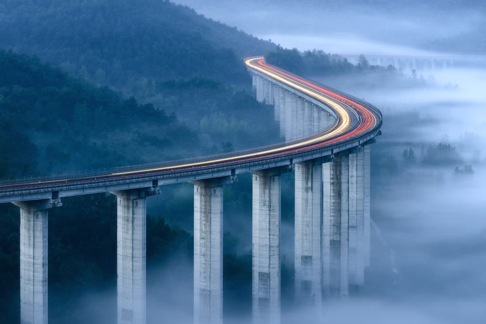 Misty Mountain Bridge Lights by Riccardo Lucidi — canvas wall art