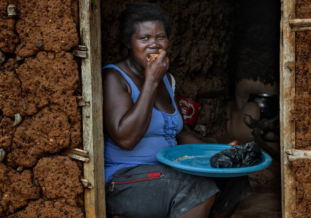 African Woman Daily Meal by Joxe Inazio Kuesta Garmendia — canvas wall art