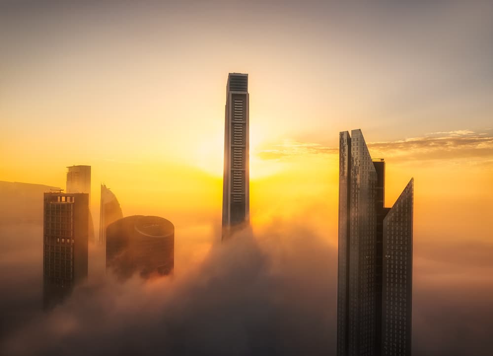 Skyscrapers In Golden Fog by joanaduenas — canvas wall art