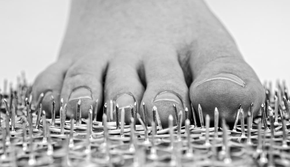 Foot On Nails by Mike Melnotte — canvas wall art