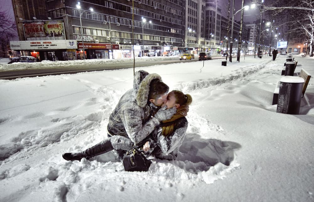 Snowy City Kiss by Vlad Eftenie — canvas wall art