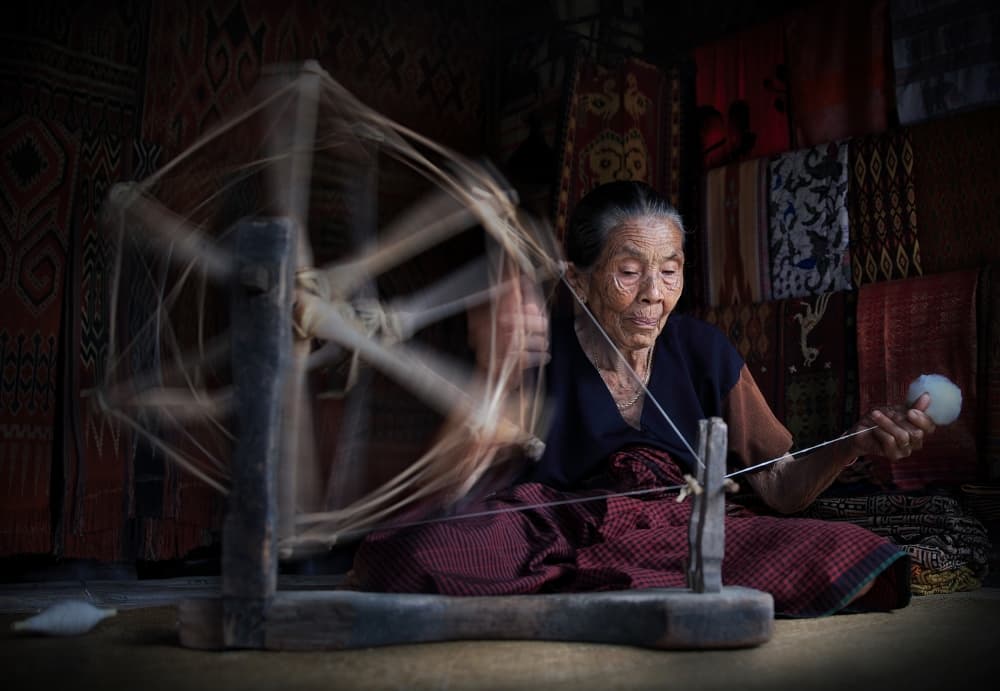 Old Woman Spinning Yarn by Aman Ali Surachman — canvas wall art