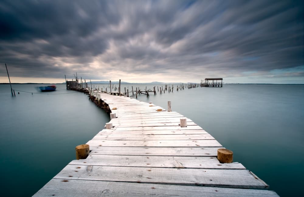 Moody Wooden Pier by Jorge Feteira — canvas wall art