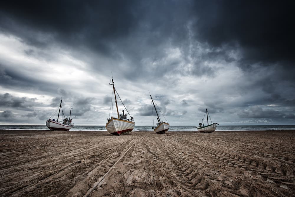Stormy Beach Boats by fotomarion — canvas wall art