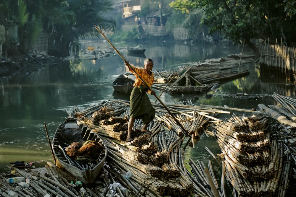 Man on Bamboo Raft by ADIREK M — canvas wall art
