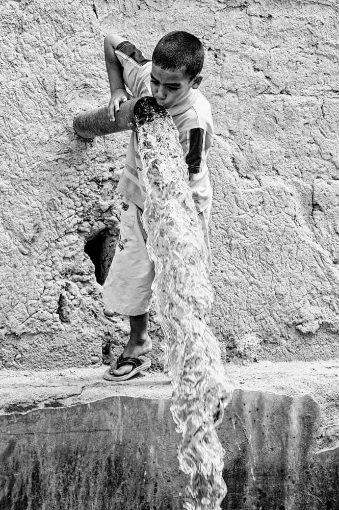 Boy Drinking Flowing Water by Raffaele Maglione — canvas wall art