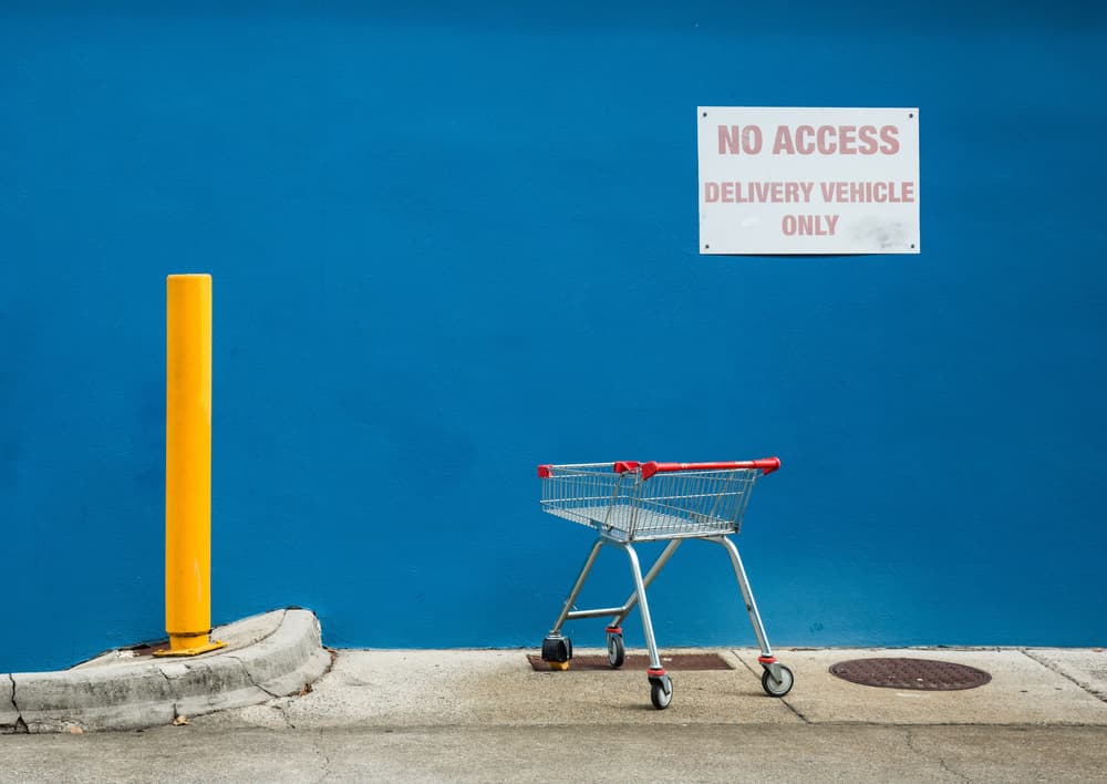 Blue Wall Yellow Bollard by Jacqueline Hammer — canvas wall art