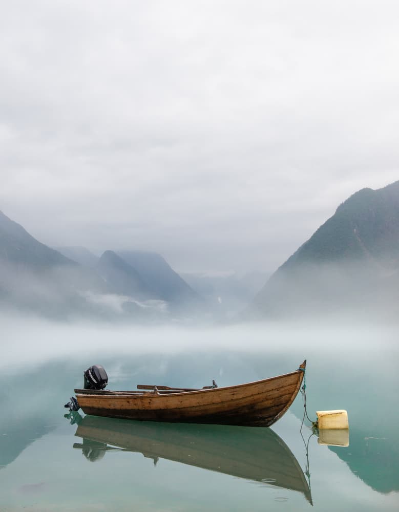 Wooden Boat Misty Lake by Claes Thorberntsson — canvas wall art
