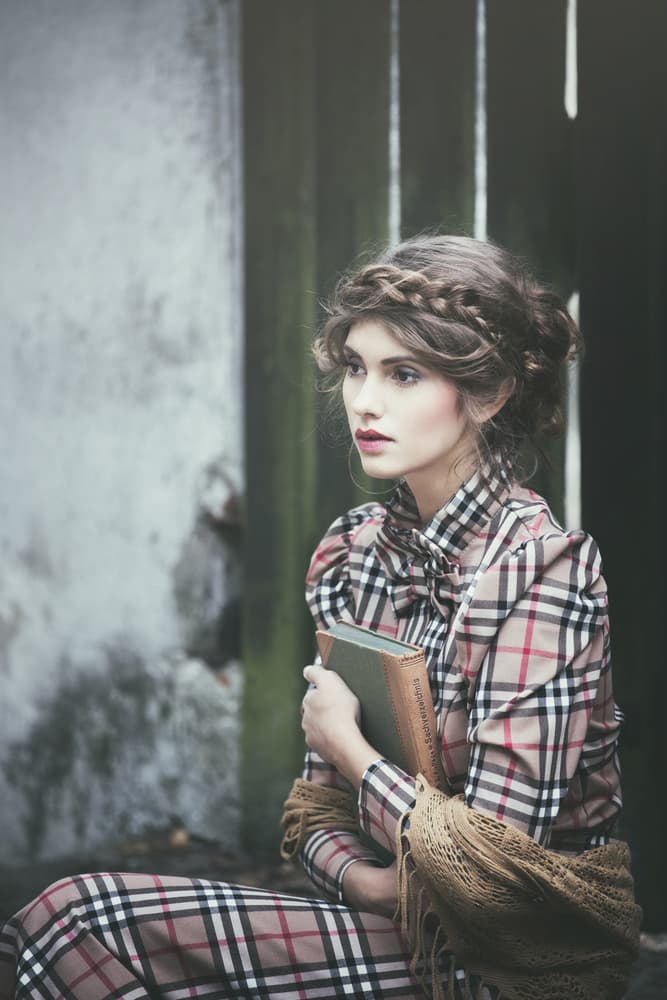 Pensive Woman with Book by Magdalena Russocka — canvas wall art