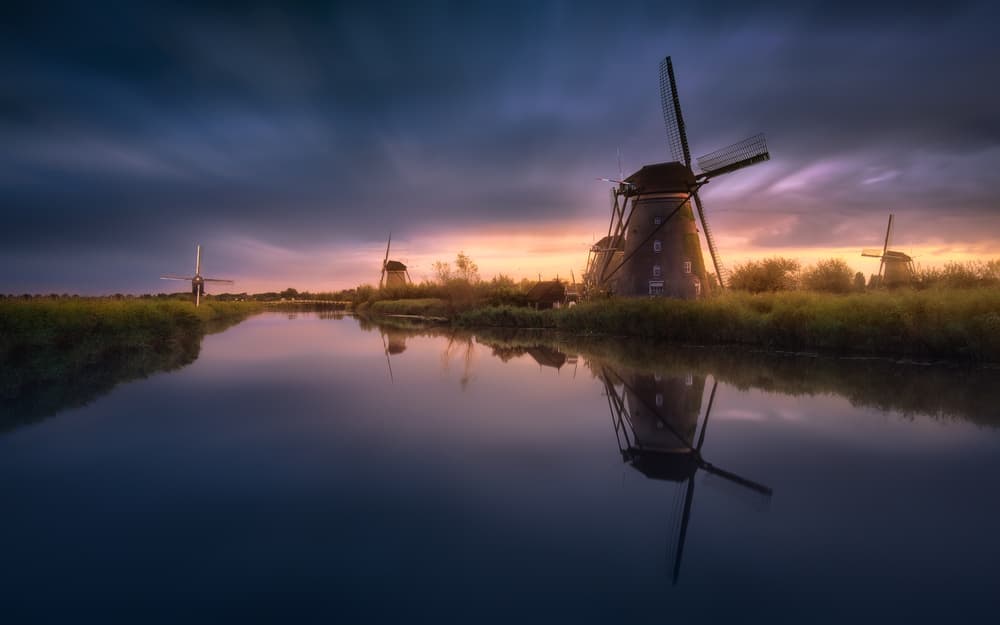 Dutch Windmills at Dusk by Jesús M. García — canvas wall art