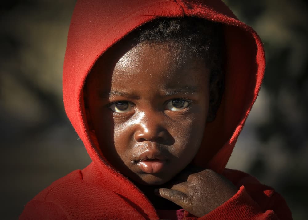 Solemn Child in Red by Raymond Ren Rong Liu — canvas wall art