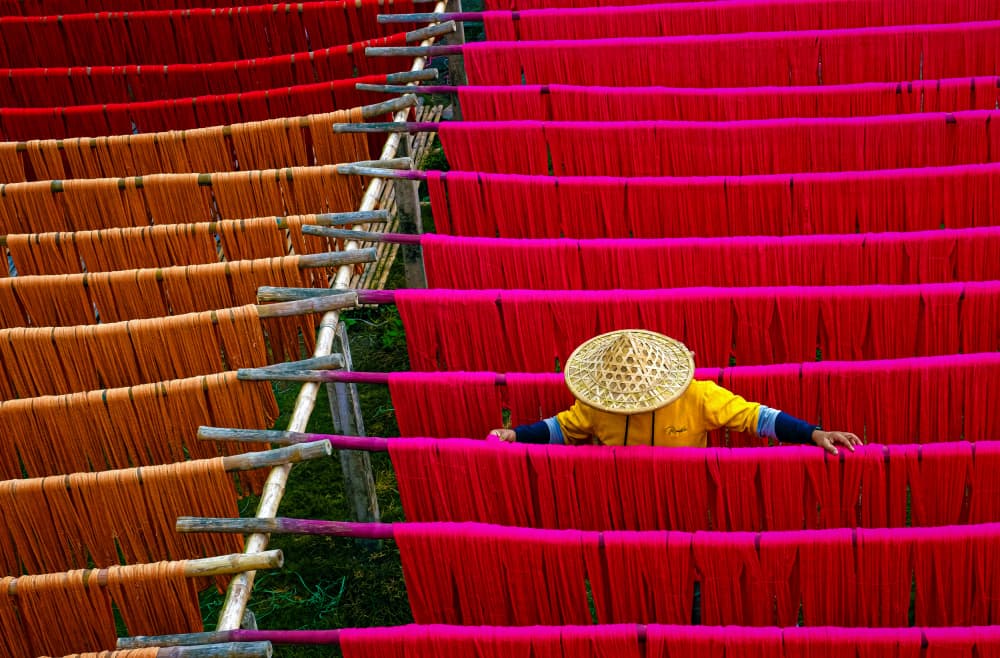 Vibrant Drying Yarns by Ajit Kumar Majhi — canvas wall art