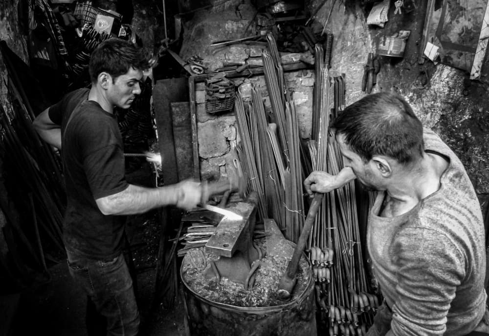 Blacksmiths At Work by Bashar Alsofey — canvas wall art