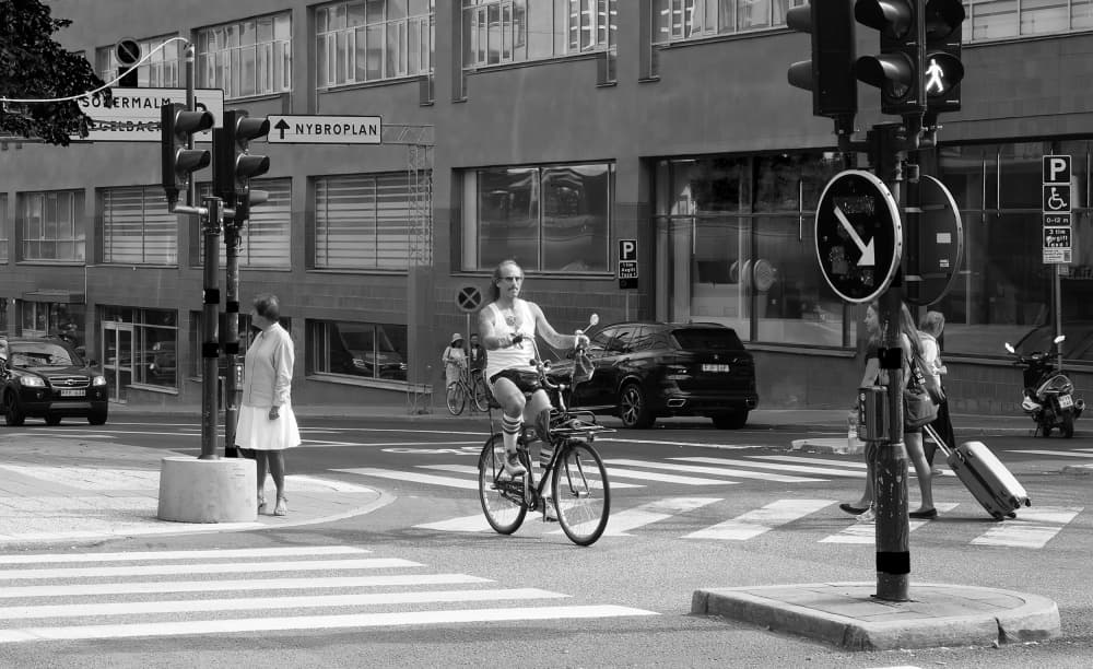 City Cyclist Crossing by Erik Engström — canvas wall art