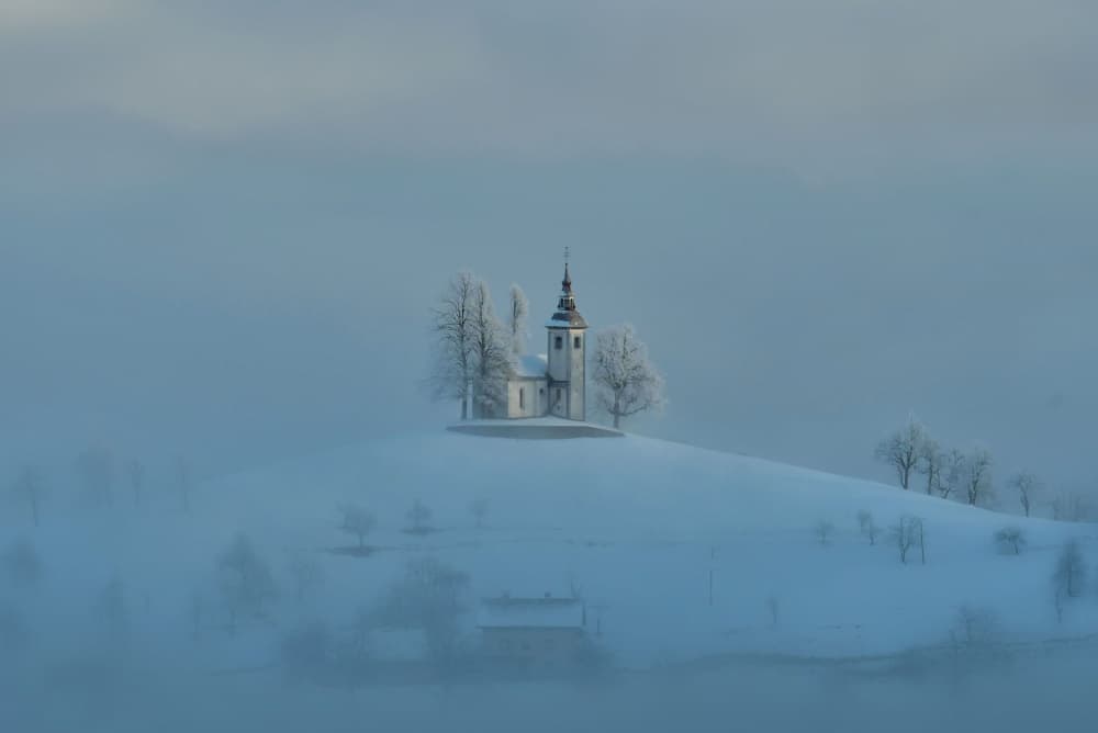 Foggy Winter Church by Bojan Kolman — canvas wall art