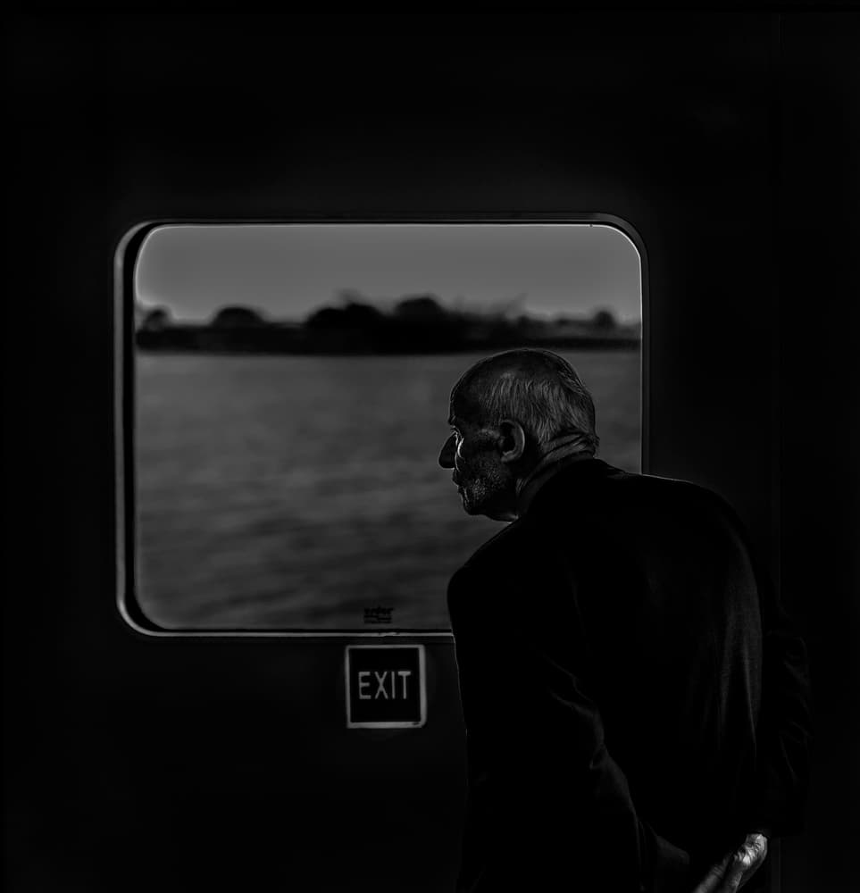 Man by Ferry Window by Ömer Ates Kızıltug — canvas wall art