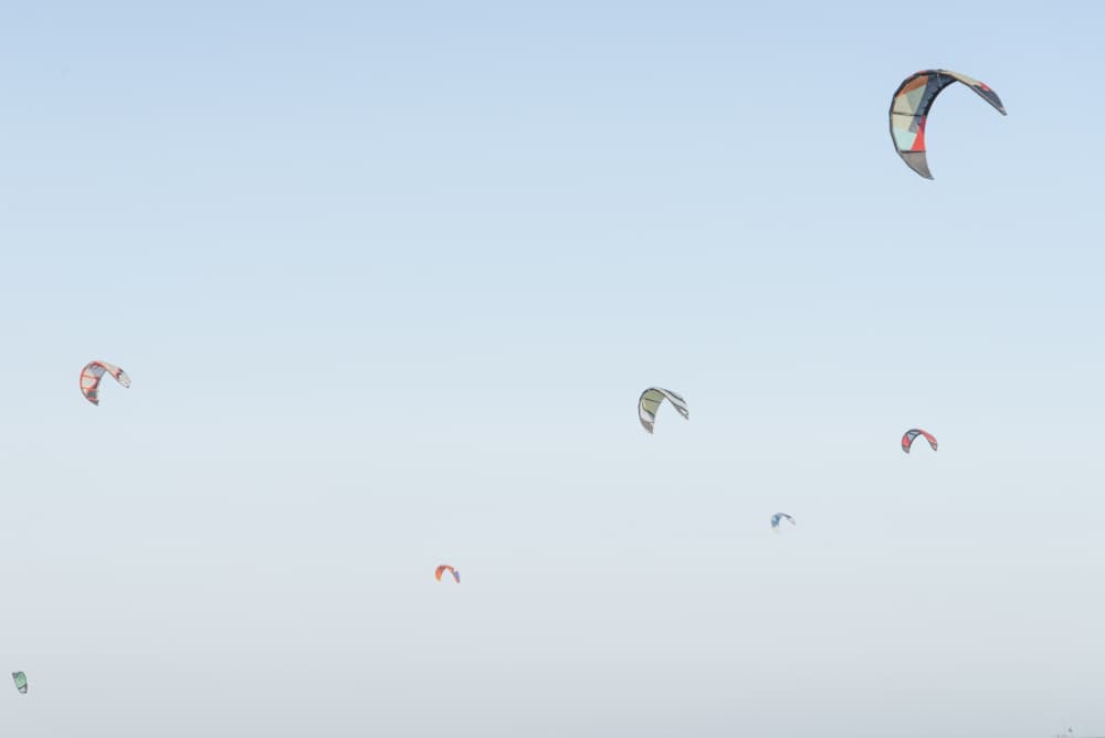 Kites Soaring Blue Sky by Lynann Colligan — canvas wall art