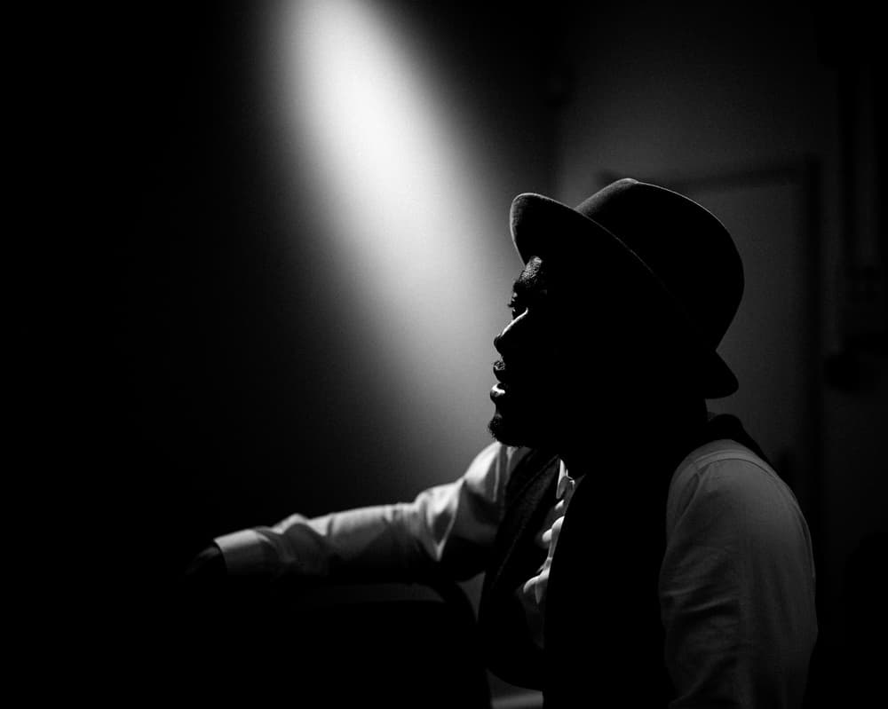 Moody Man In Hat by Richard Bland — canvas wall art