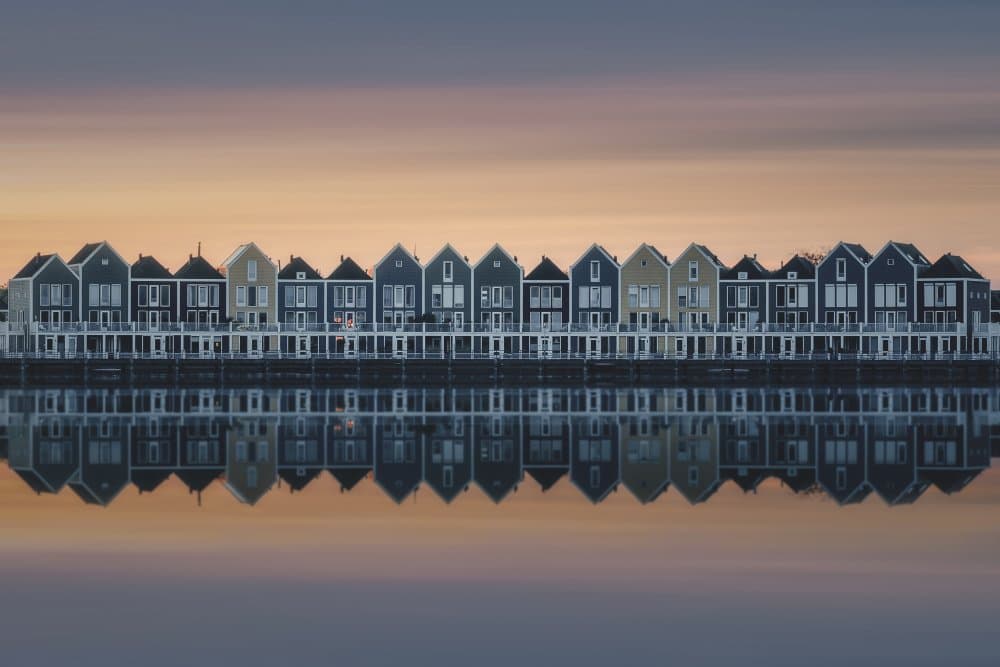 Mirrored Waterfront Homes by Thomas de Franzoni — canvas wall art