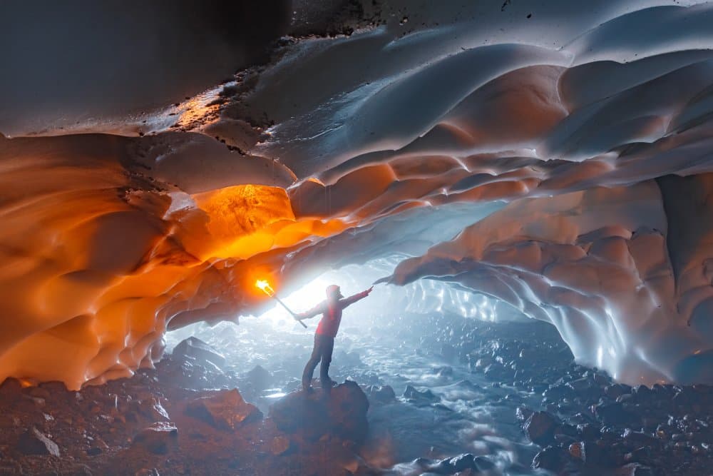 Torchlit Ice Cave by Denis Budkov — canvas wall art