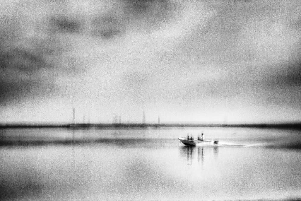 Moody Boat on Water by Ina Tänzer — canvas wall art