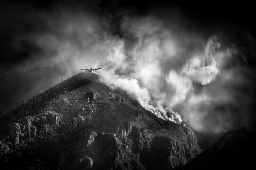 Firefighting Plane Over Peaks by Alessandro Traverso — canvas wall art